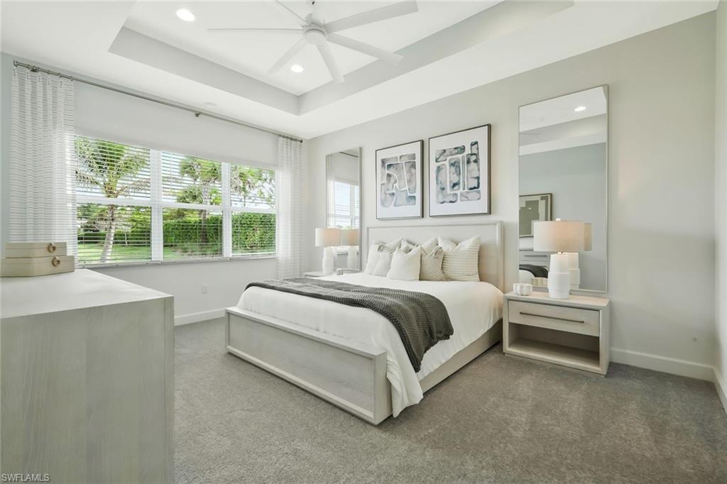 11805 Drake Lane Naples, FL 34120 - Photo 15 of 30 a spacious bedroom with a large bed and a window
