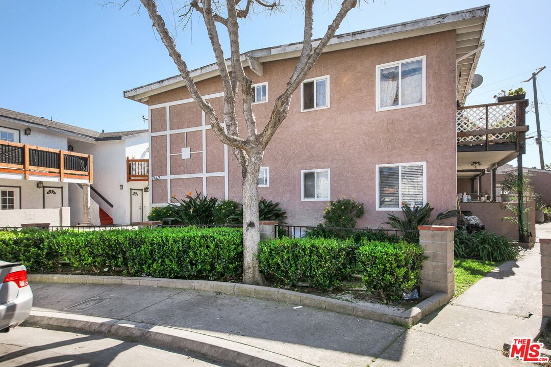 7642 Amberleaf Circle Huntington Beach, CA 92648 - Photo 6 of 9 a front view of a house with potted plants
