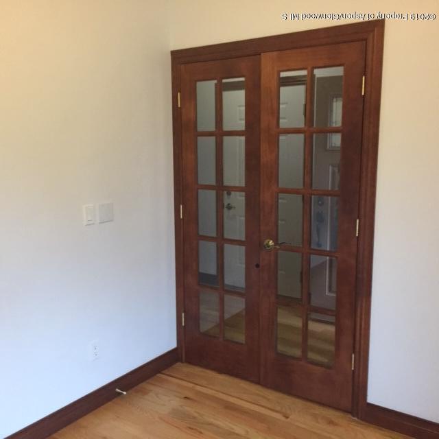 1453 Fir Court Rifle, CO 81650 - Photo 2 of 28 an empty room with wooden floor and closet