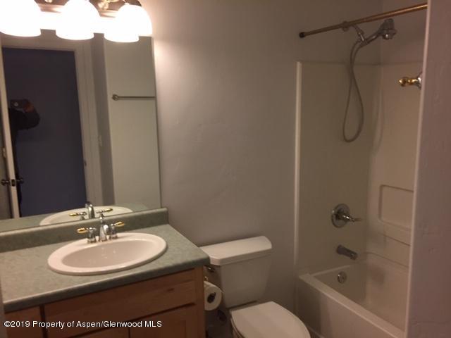 1453 Fir Court Rifle, CO 81650 - Photo 23 of 28 a bathroom with a sink toilet and shower