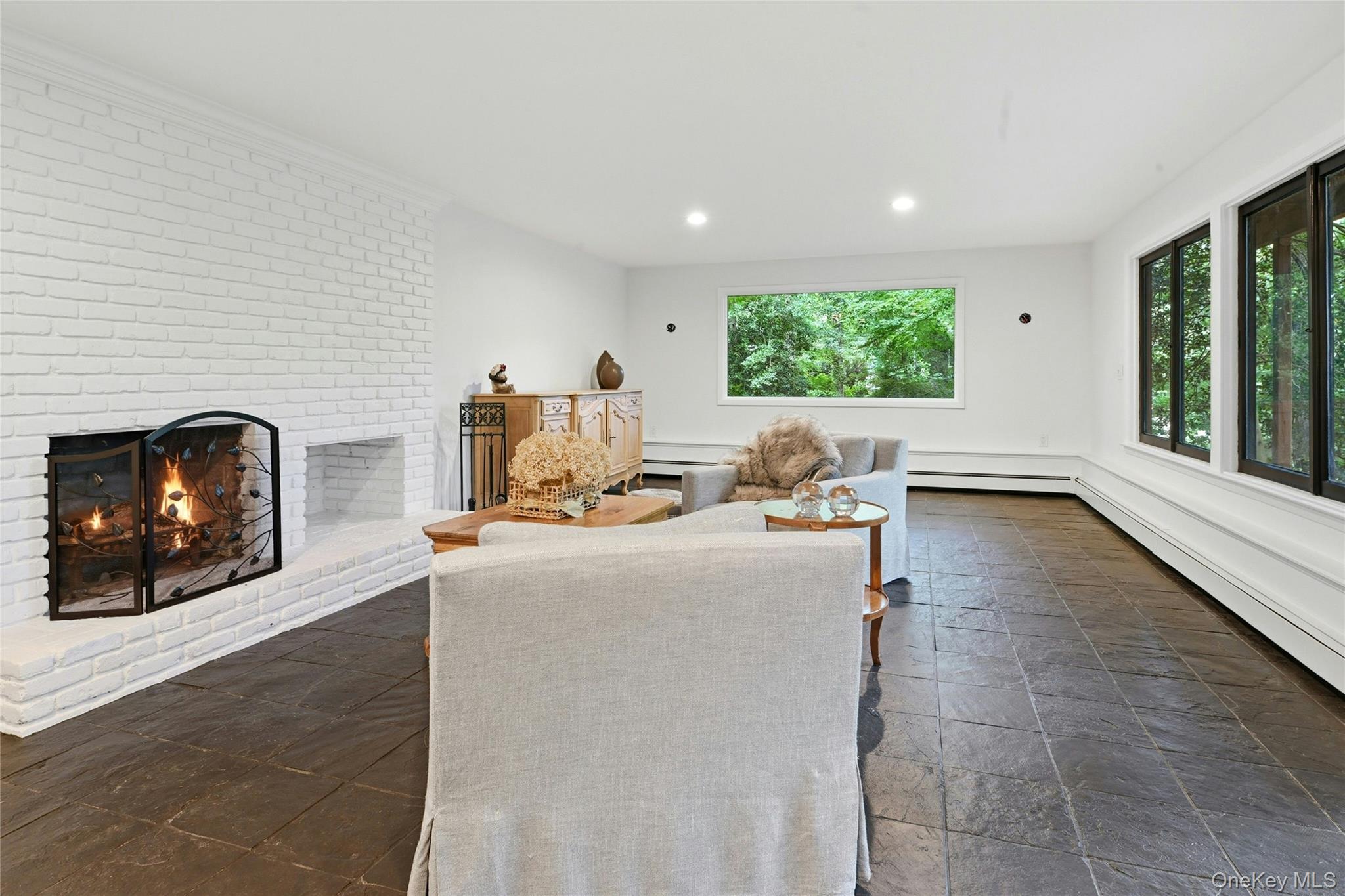 75 Laurel Hill Road Centerport, NY 11721 - Photo 18 of 28 Lower level living room with wood burning fireplace