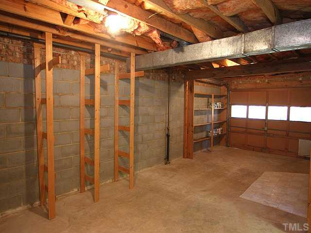 4512 Connell Drive Raleigh, NC 27612 - Photo 19 of 25 Storage with overhead door.....works for lawn and garden equipment, storage of bikes, sailboat, sporting equipment, hobby room. New HVAC with sanitizer (cost over $7,000) New 30 year warranty roof; new water heater! Storage