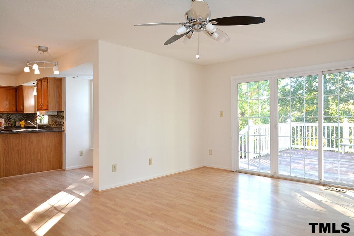 604 Carpenter Fletcher Road Durham, NC 27713 - Photo 11 of 24 Sliding glass doors from the family room to the deck.