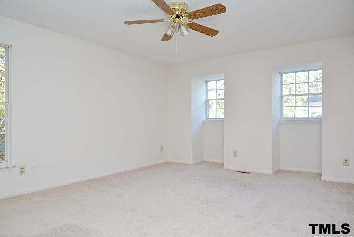 604 Carpenter Fletcher Road Durham, NC 27713 - Photo 16 of 24 Spacious master bedroom with 2 dormers adds unique character to the room.