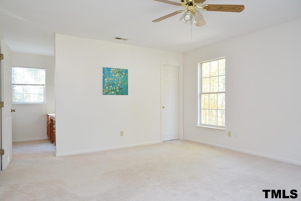 604 Carpenter Fletcher Road Durham, NC 27713 - Photo 17 of 24 Taken from the dormer side of the master bedroom looking into the closet to the right and the master bathroom to the left.