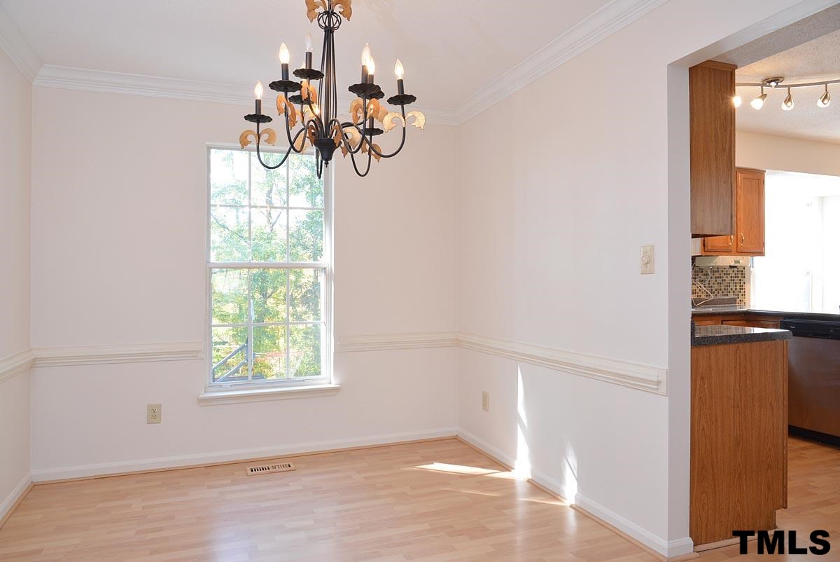Nice formal dining room overlooking the wooded backyard!