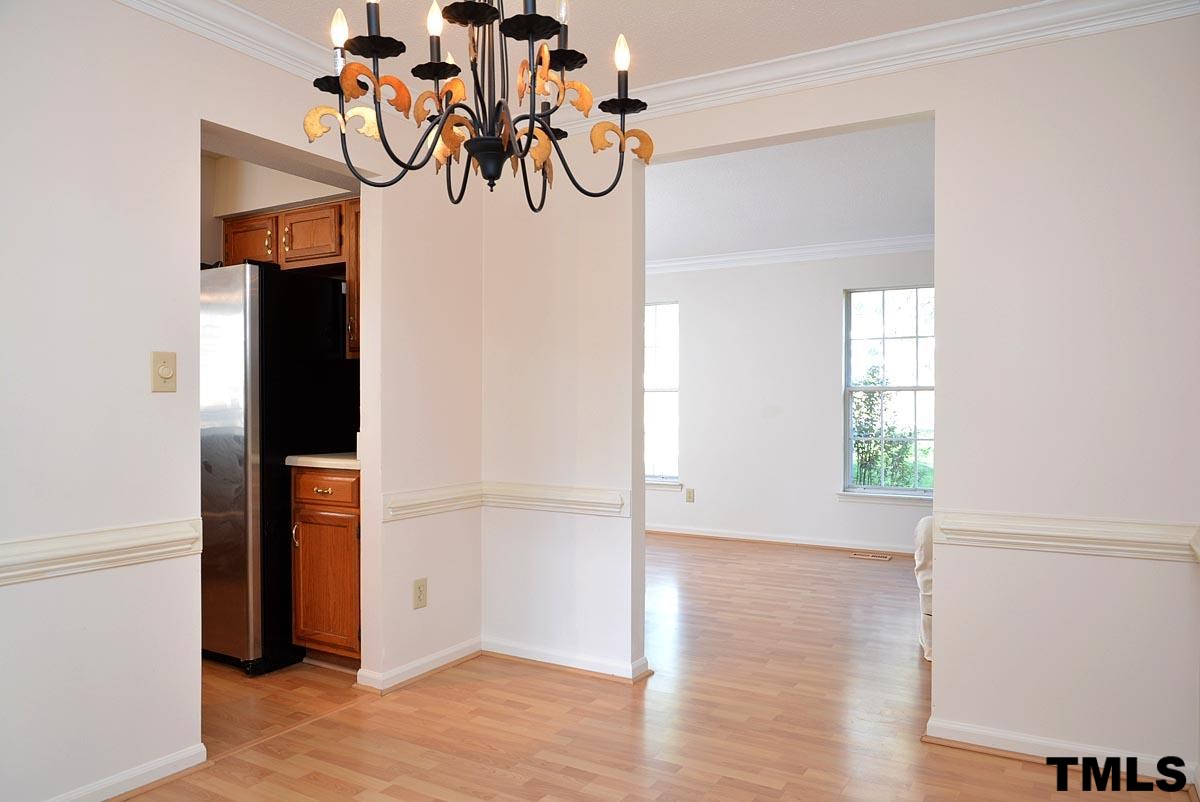 Taken from the formal dining area looking towards the formal living room and the kitchen to the left.