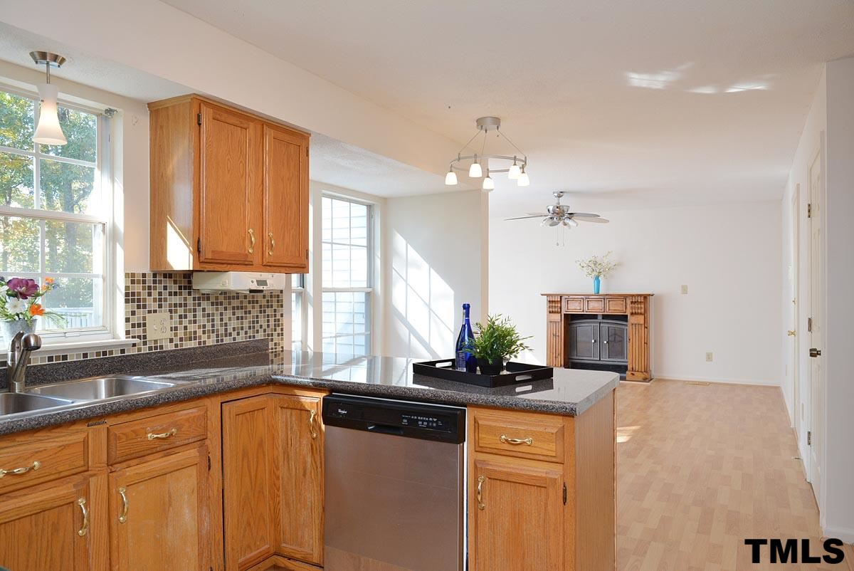 604 Carpenter Fletcher Road Durham, NC 27713 - Photo 8 of 24 Kitchen opens up to the breakfast nook and the family room.
