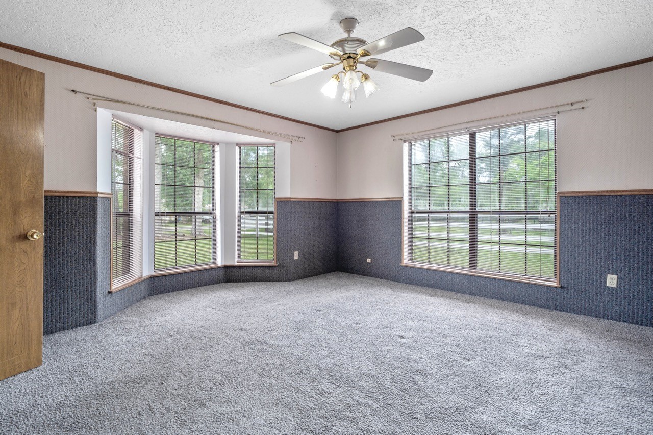 13180 Morgan Drive Splendora, TX 77372 - Photo 21 of 38 Primary bedroom facing the front yard.