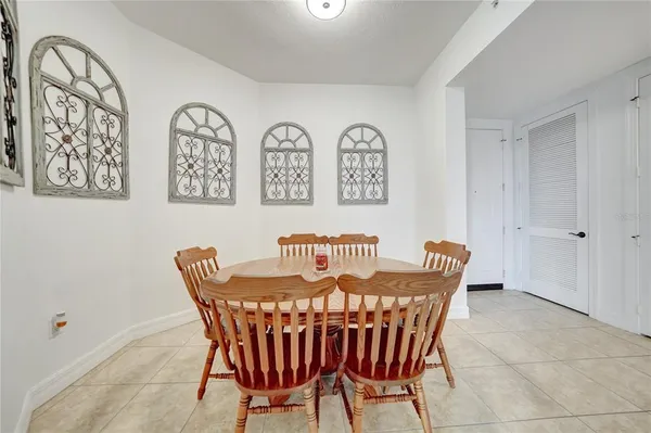a view of a dining room and kitchen with furniture