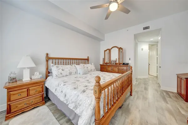 a spacious bathroom with a double vanity sink mirror and bathtub
