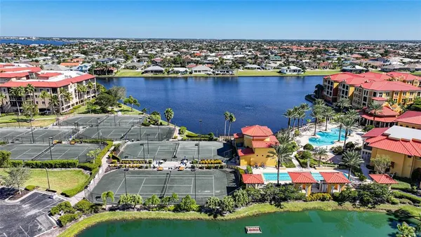 a view of a swimming pool with outdoor seating