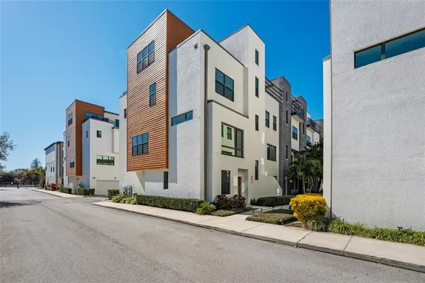 a front view of a building with a yard