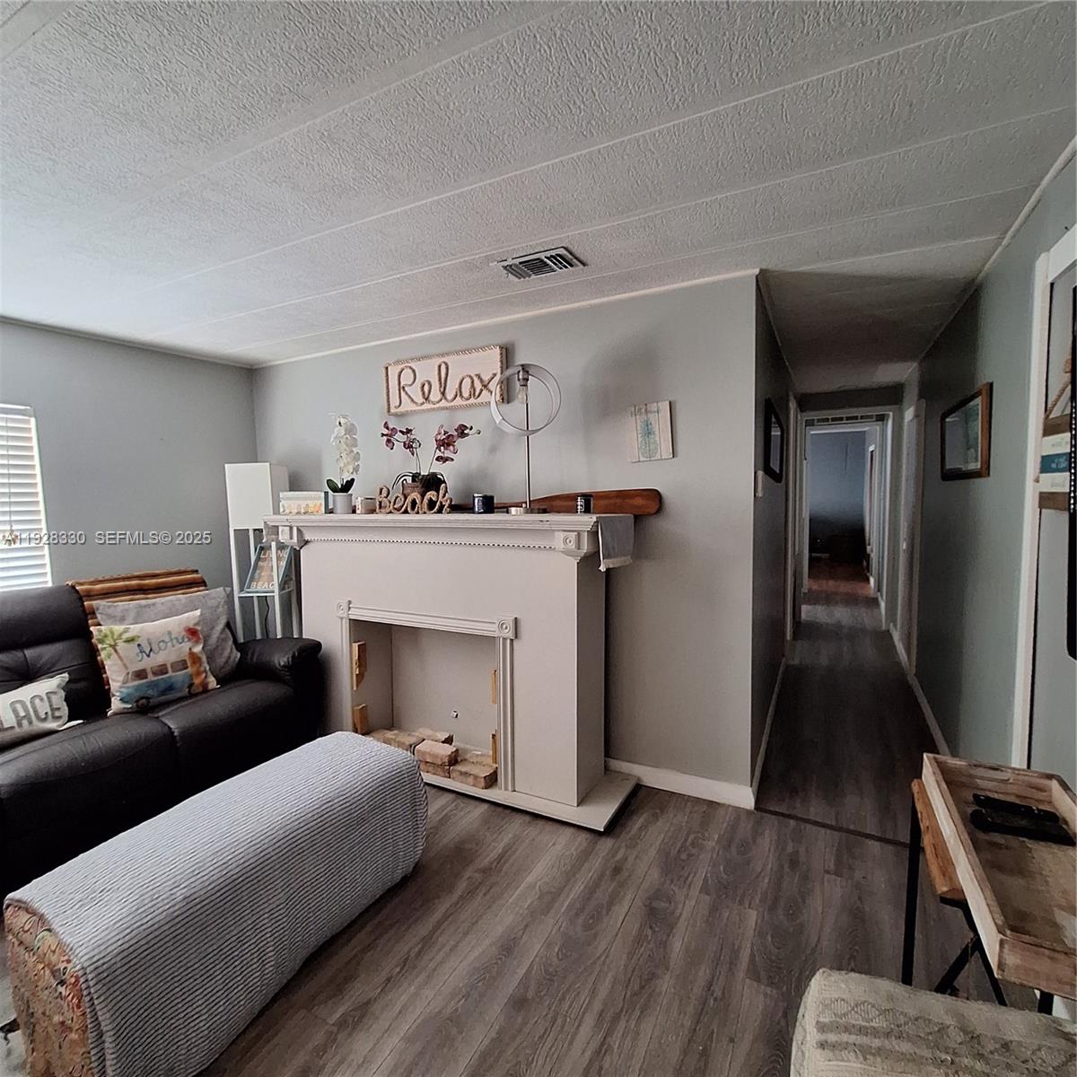 256 Lee Avenue Key Largo, FL 33037 - Photo 9 of 11 a living room with furniture and a fireplace