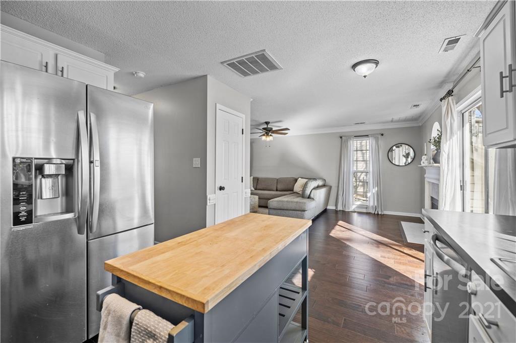 4010 Suttle Place Matthews, NC 28104 - Photo 16 of 31 a room with a table chairs and a refrigerator