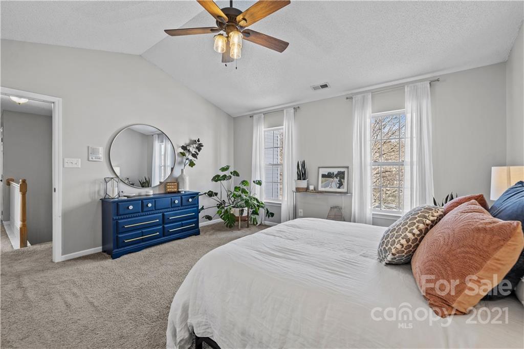 4010 Suttle Place Matthews, NC 28104 - Photo 19 of 31 a bed room with a bed and a mirror