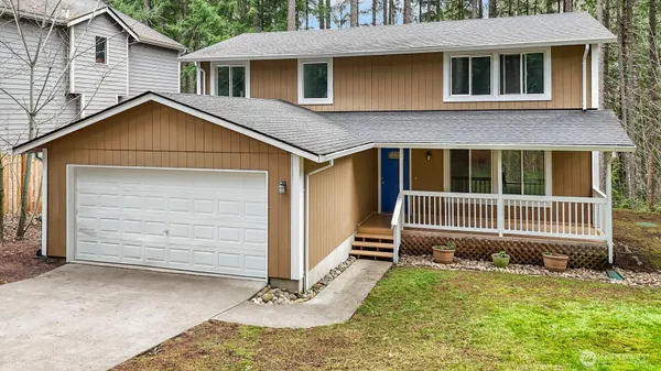 a front view of a house with a garage