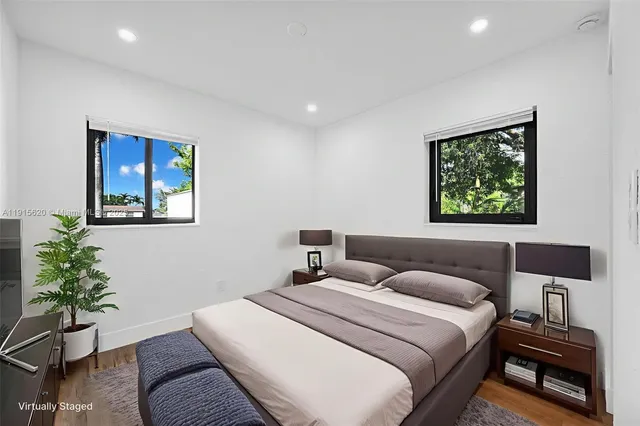 a view of room with wooden floor and window