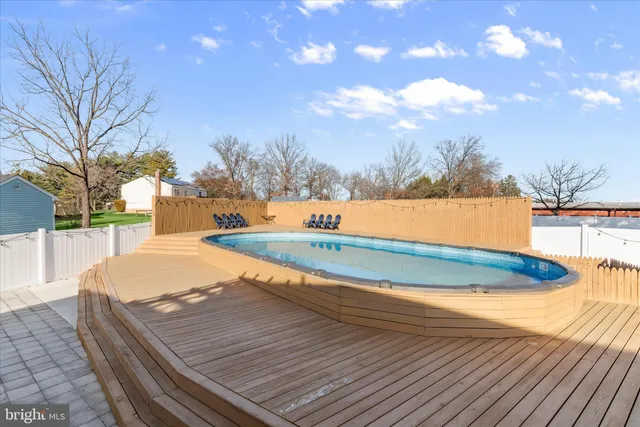 a view of a chairs and table in the balcony