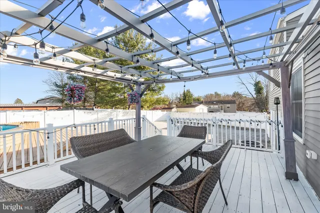 a aerial view of a house with a big yard and large trees
