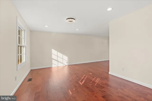 a kitchen with white cabinets and appliances