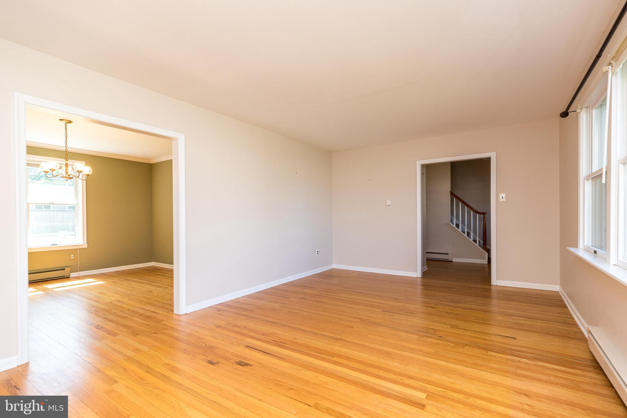 231 Parry Road Warminster, PA 18974 - Photo 11 of 71 a view of an empty room with wooden floor and a window