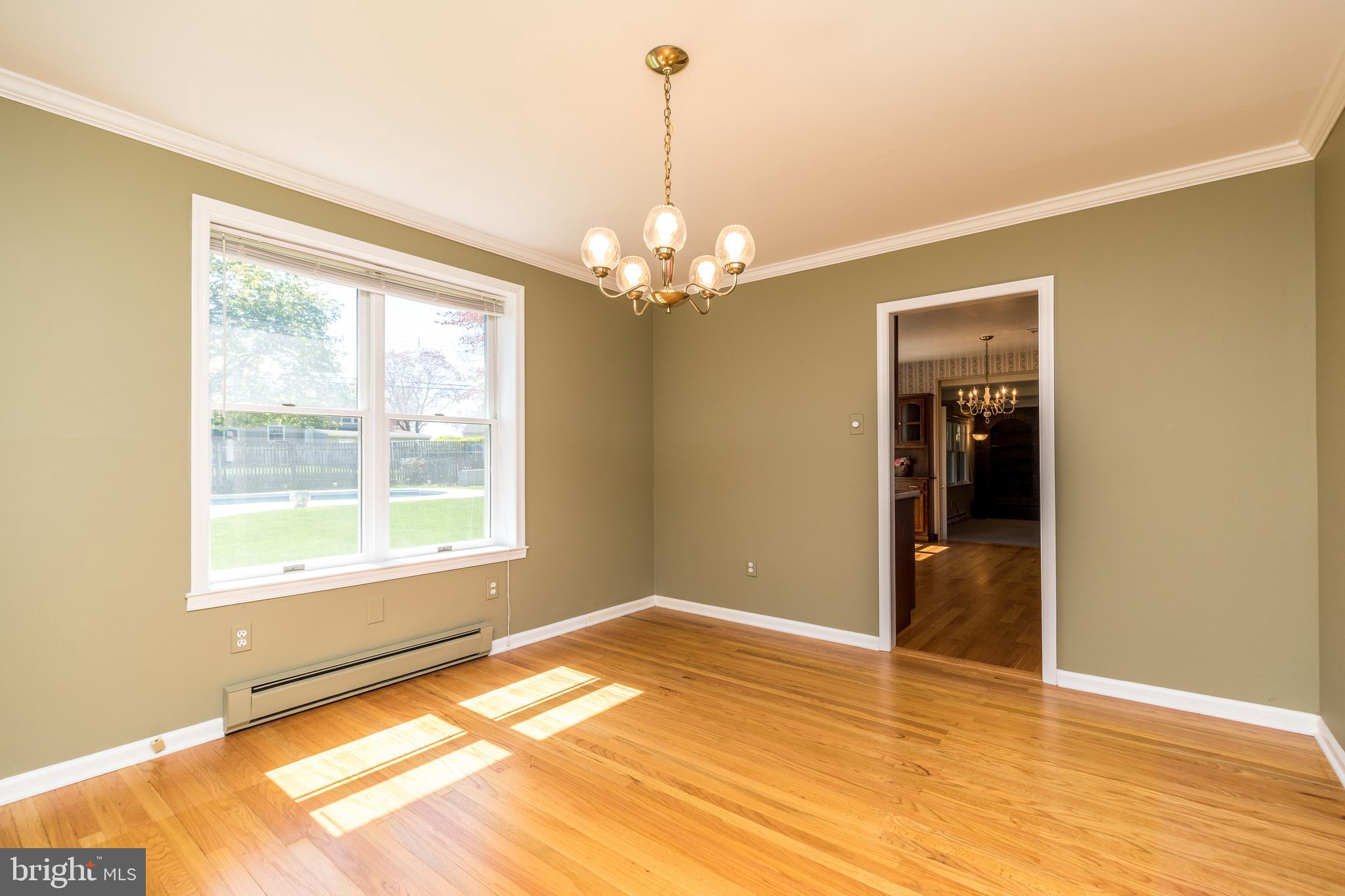 231 Parry Road Warminster, PA 18974 - Photo 15 of 71 a view of an empty room with wooden floor and a window