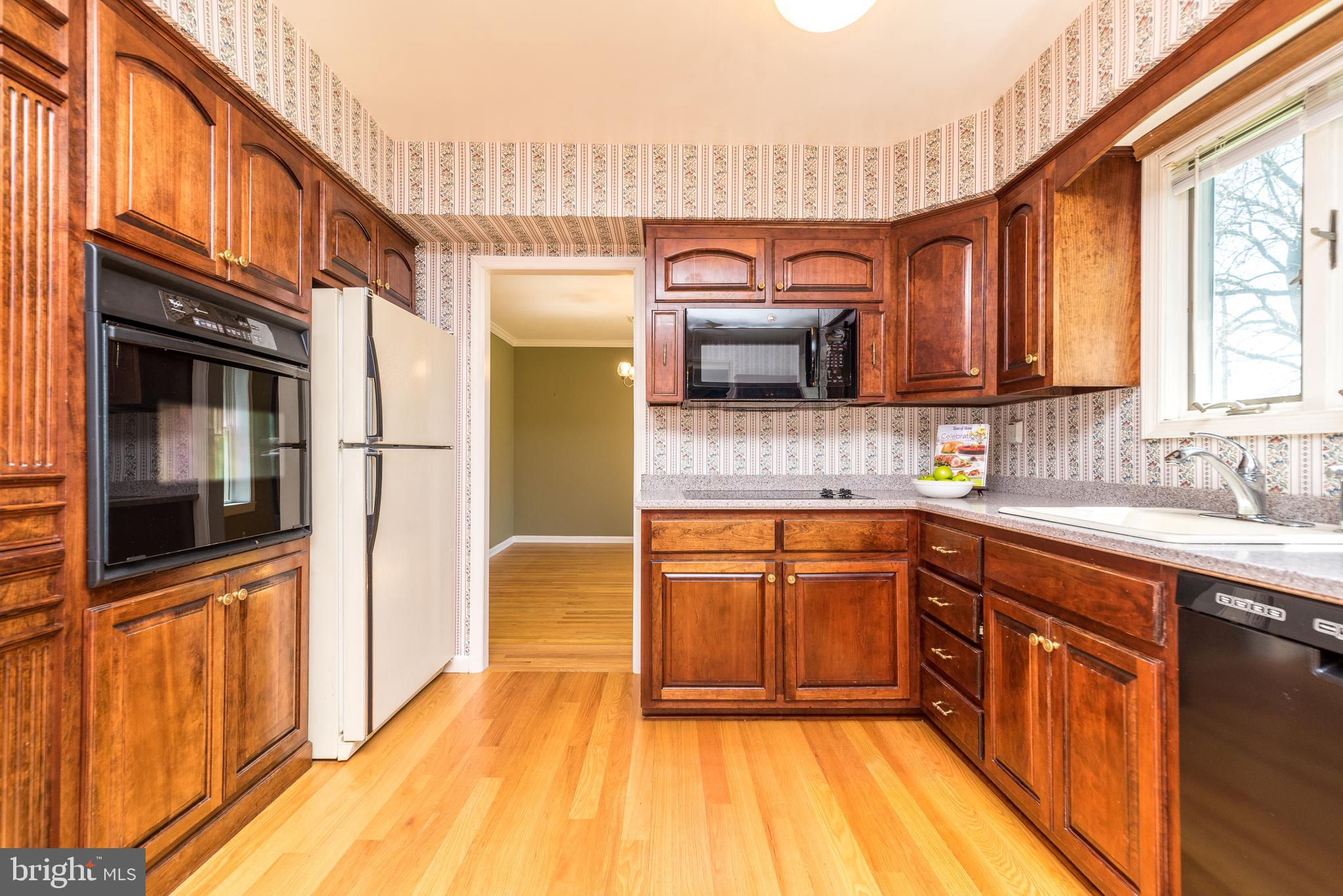231 Parry Road Warminster, PA 18974 - Photo 16 of 71 a kitchen with stainless steel appliances granite countertop a sink and a stove