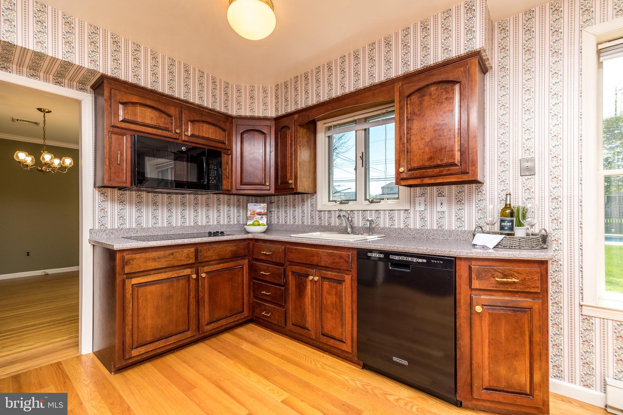 231 Parry Road Warminster, PA 18974 - Photo 17 of 71 a kitchen with stainless steel appliances granite countertop a sink stove and microwave