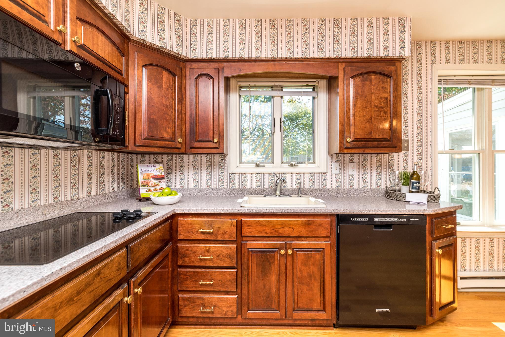 231 Parry Road Warminster, PA 18974 - Photo 22 of 71 a kitchen with stainless steel appliances granite countertop a sink a stove a counter space and cabinets