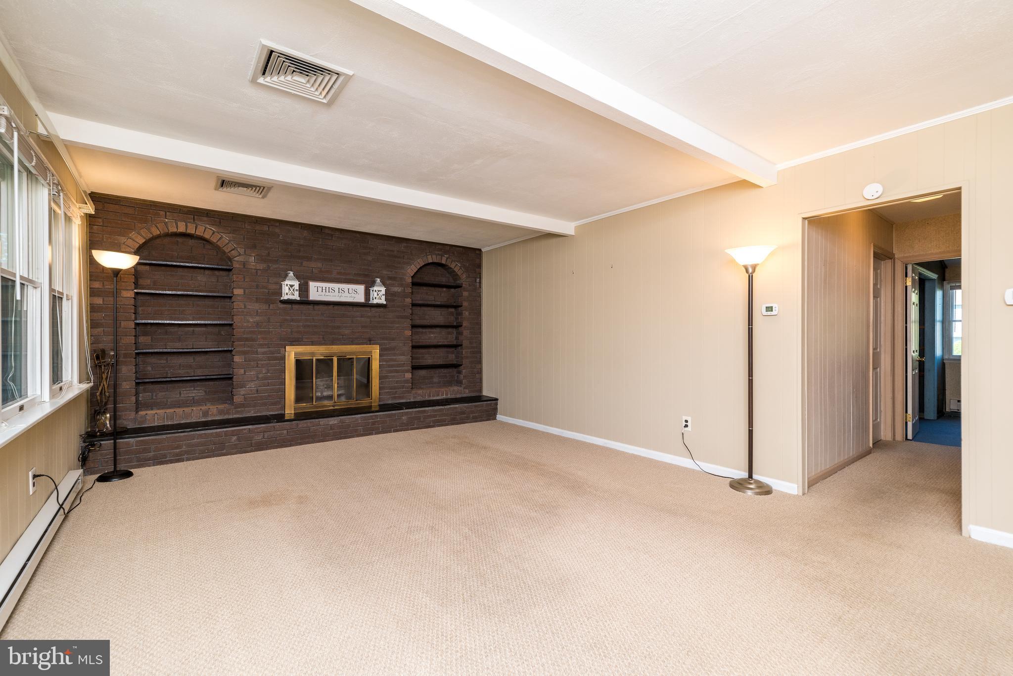 231 Parry Road Warminster, PA 18974 - Photo 28 of 71 a view of empty room with window and fireplace
