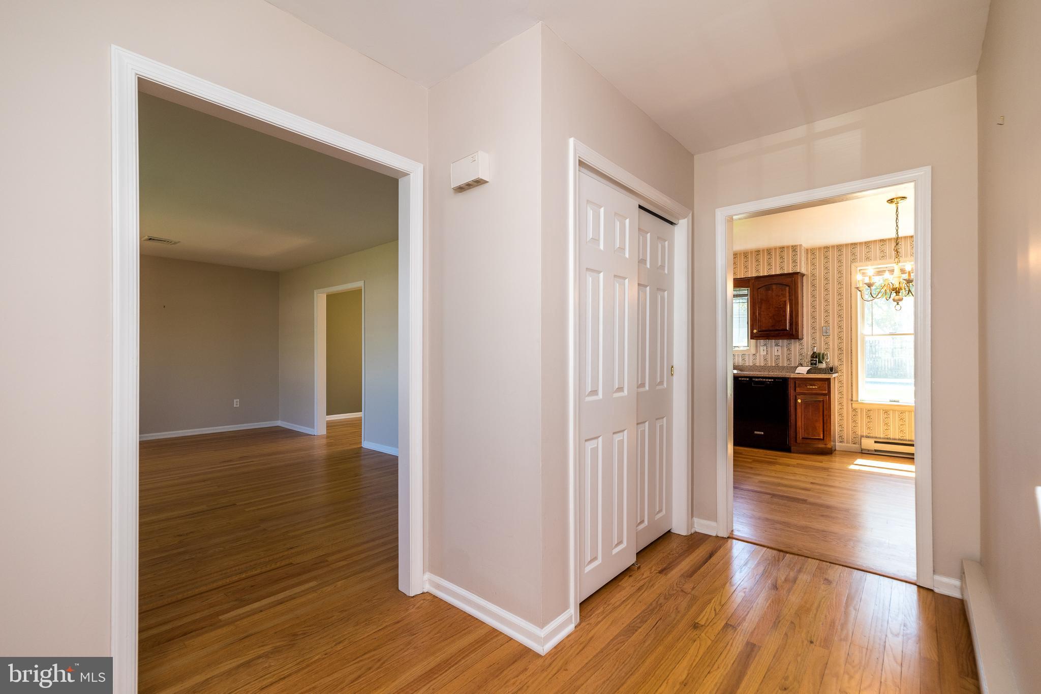 231 Parry Road Warminster, PA 18974 - Photo 36 of 71 a view of a hallway with wooden floor and dining room