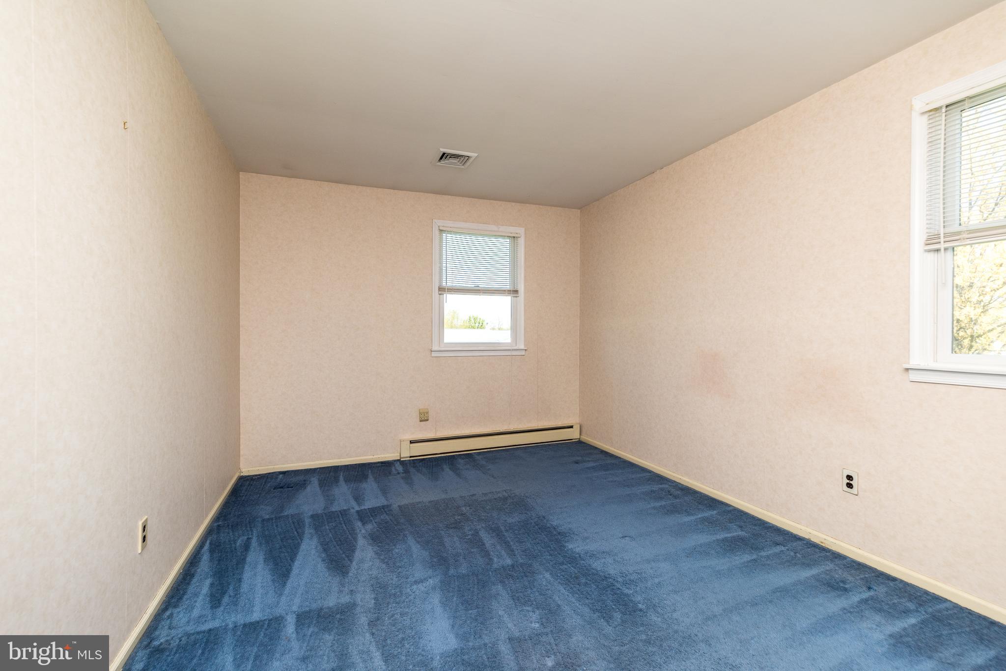 231 Parry Road Warminster, PA 18974 - Photo 43 of 71 an empty room with wooden floor and windows
