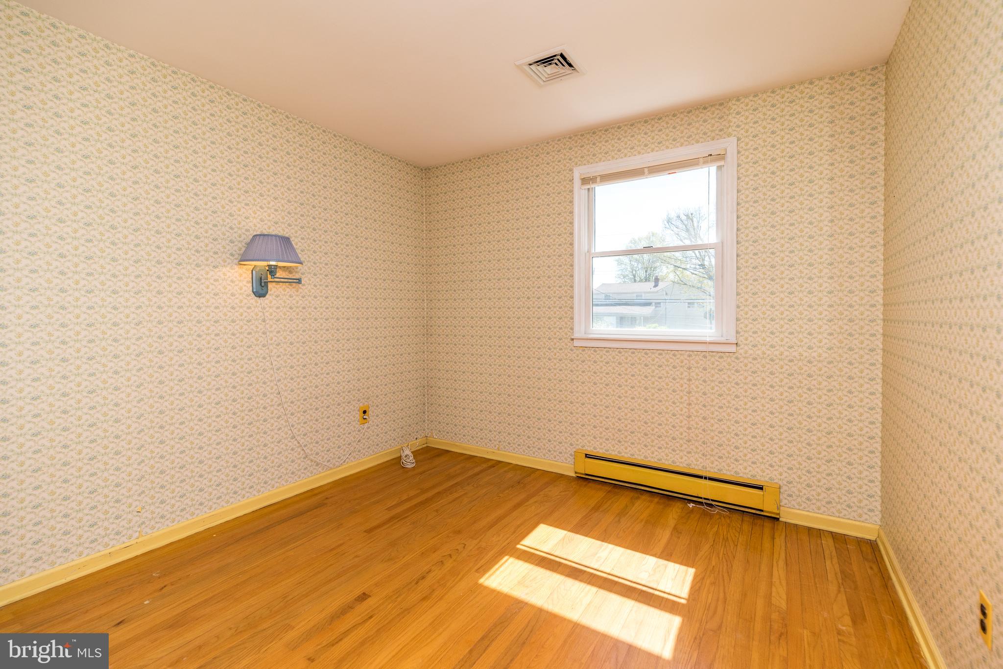 231 Parry Road Warminster, PA 18974 - Photo 44 of 71 a view of a room with wooden floor and a window