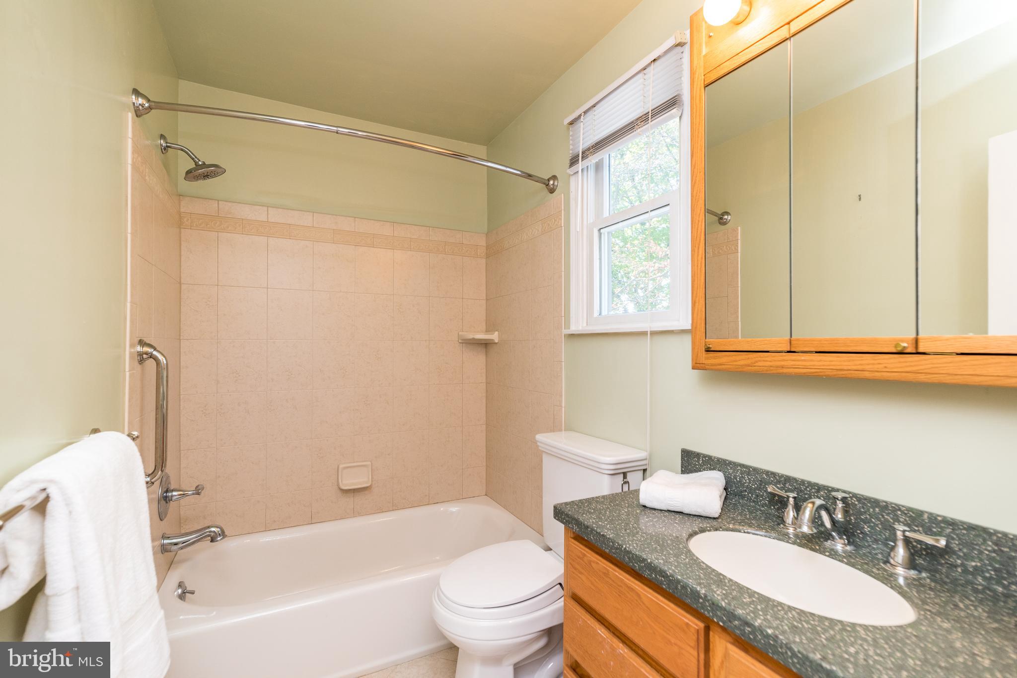 231 Parry Road Warminster, PA 18974 - Photo 49 of 71 a bathroom with a granite countertop sink toilet and shower