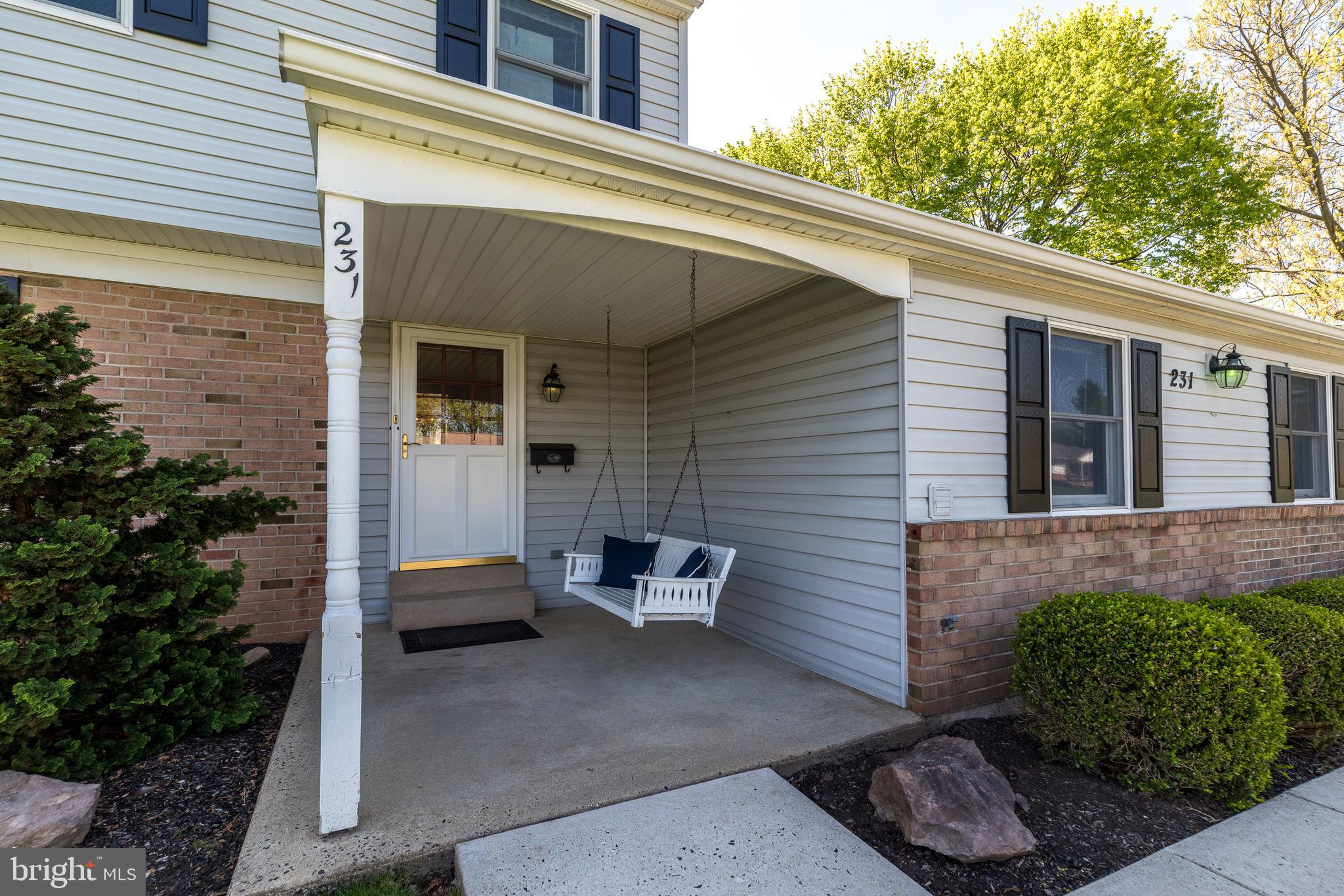 231 Parry Road Warminster, PA 18974 - Photo 7 of 71 a wooden bench sitting in front of a building