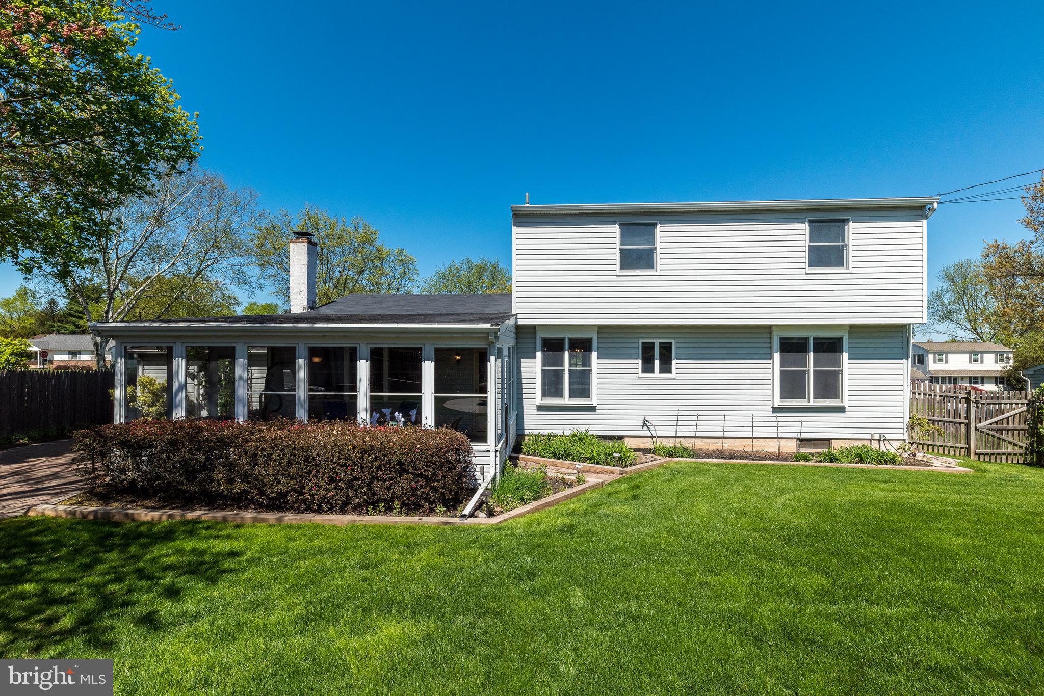 231 Parry Road Warminster, PA 18974 - Photo 67 of 71 a front view of a house with a yard and trees