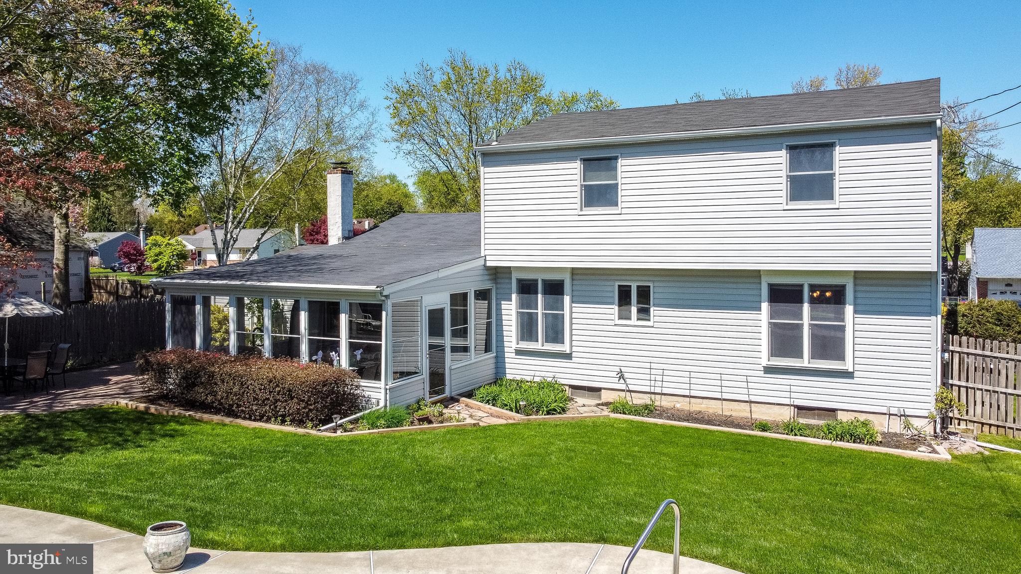 231 Parry Road Warminster, PA 18974 - Photo 69 of 71 a view of a house with a yard potted plants and a table