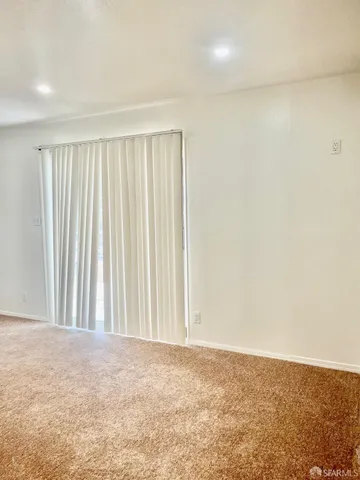 a view of a room with a wooden floor