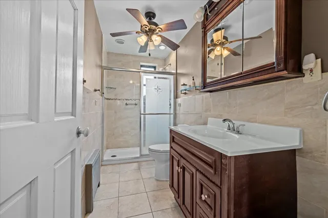 a bathroom with a sink a mirror and a shower