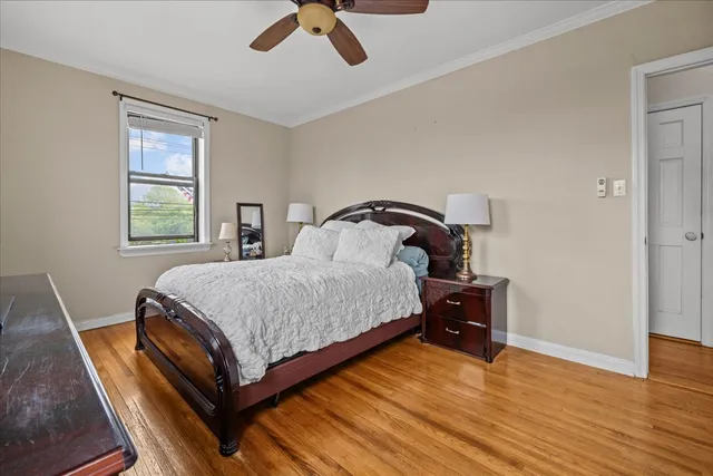 a bedroom with a bed and window