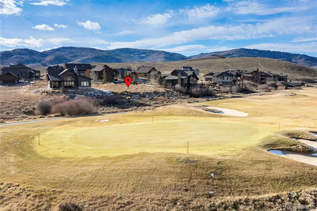 a view of a ocean with mountains in the background
