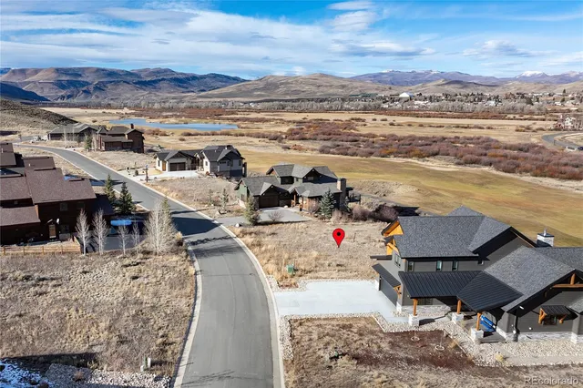 a view of a terrace with outdoor seating and ocean view