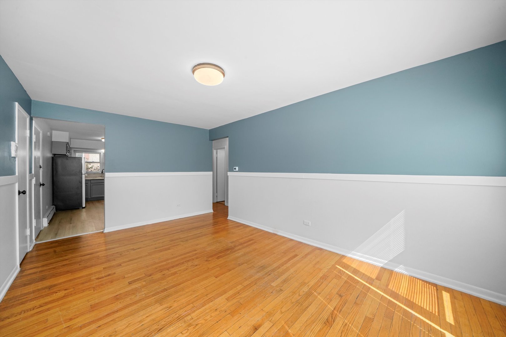8917 South Cottage Grove Avenue Chicago, IL 60619 - Photo 14 of 17 a view of a big room with wooden floor