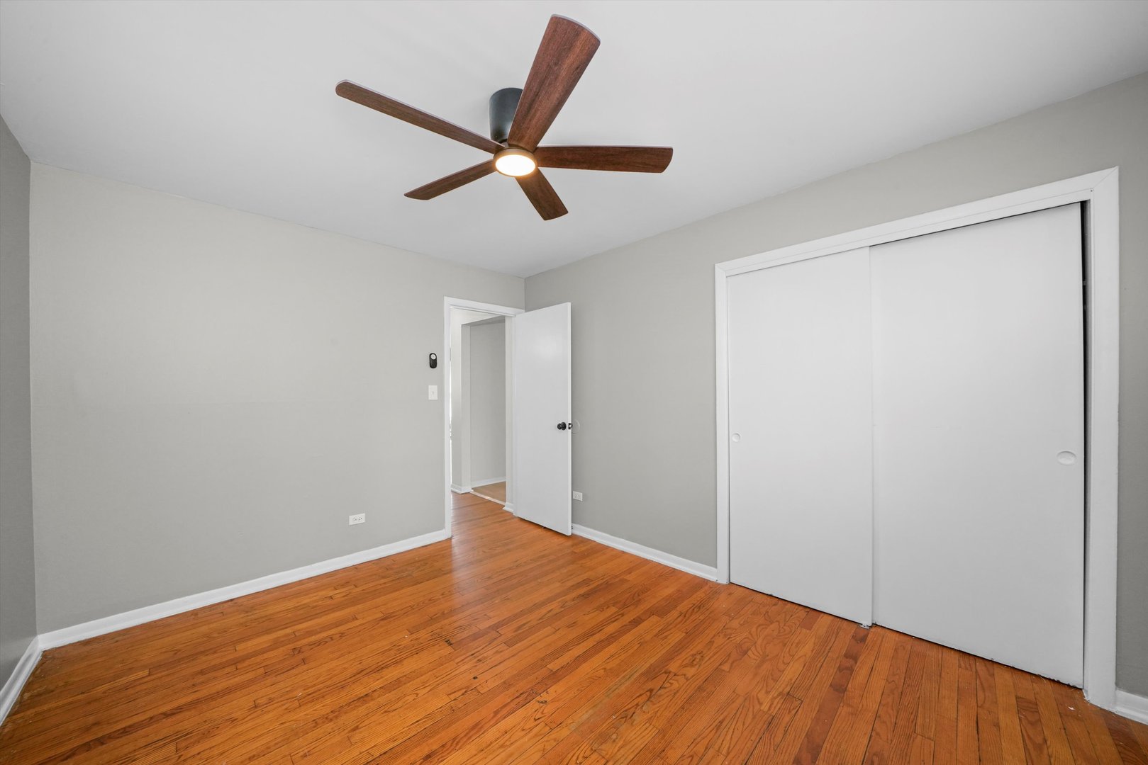 8917 South Cottage Grove Avenue Chicago, IL 60619 - Photo 5 of 17 a view of empty room with wooden floor