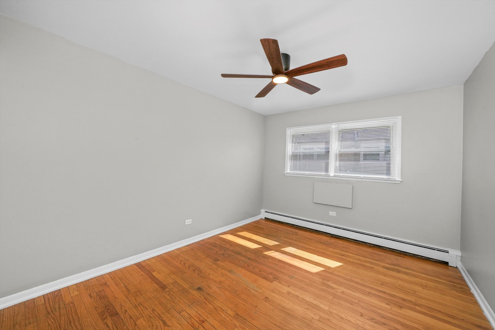 8917 South Cottage Grove Avenue Chicago, IL 60619 - Photo 7 of 17 a view of a big room with wooden floor and windows