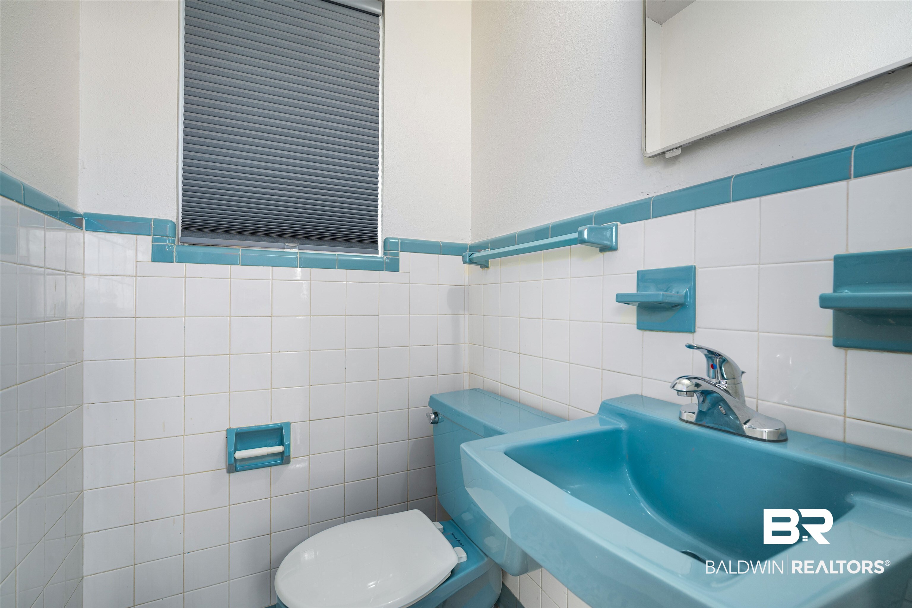 570 Markham Drive Mobile, AL 36609 - Photo 22 of 25 Bathroom featuring tile walls, a sink, and toilet