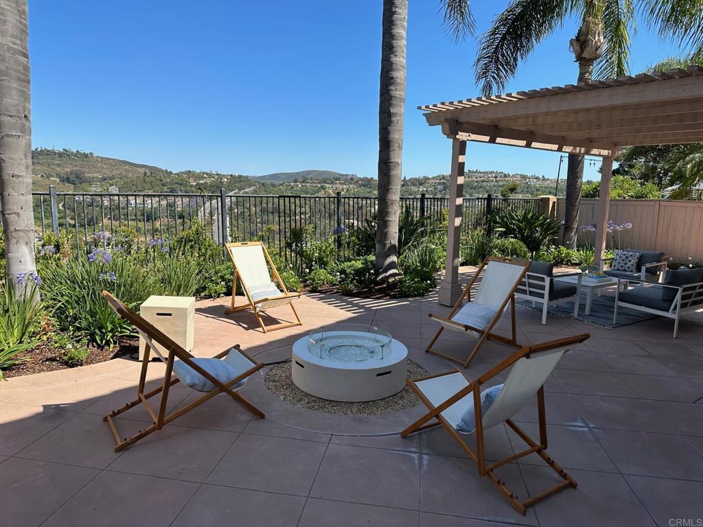 6160 Paseo Tapajos Carlsbad, CA 92009 - Photo 13 of 16 a view of a patio with a table chairs and a potted plants