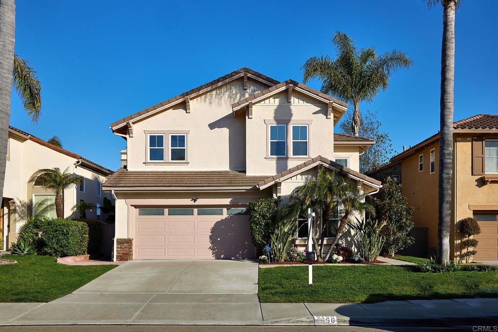 6160 Paseo Tapajos Carlsbad, CA 92009 - Photo 16 of 16 a front view of a house with a yard and potted plants