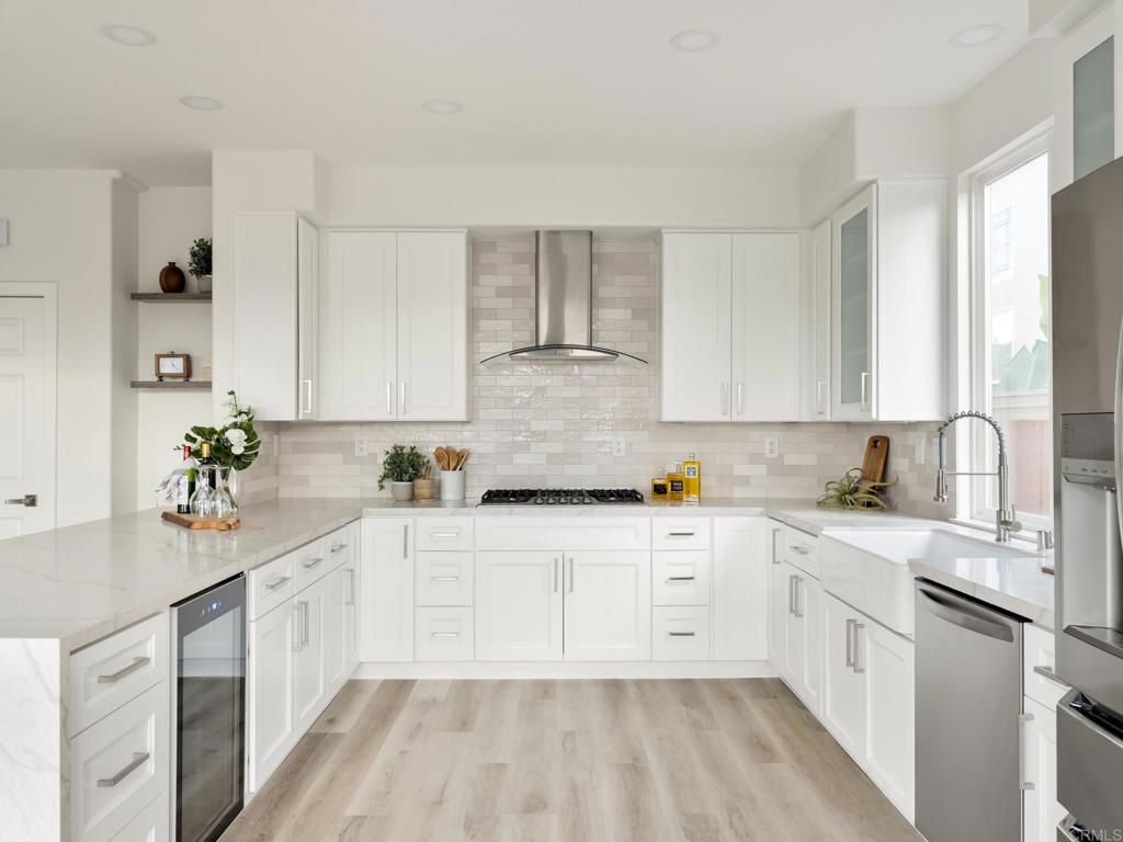 6160 Paseo Tapajos Carlsbad, CA 92009 - Photo 5 of 16 a kitchen with granite countertop a sink stainless steel appliances and cabinets